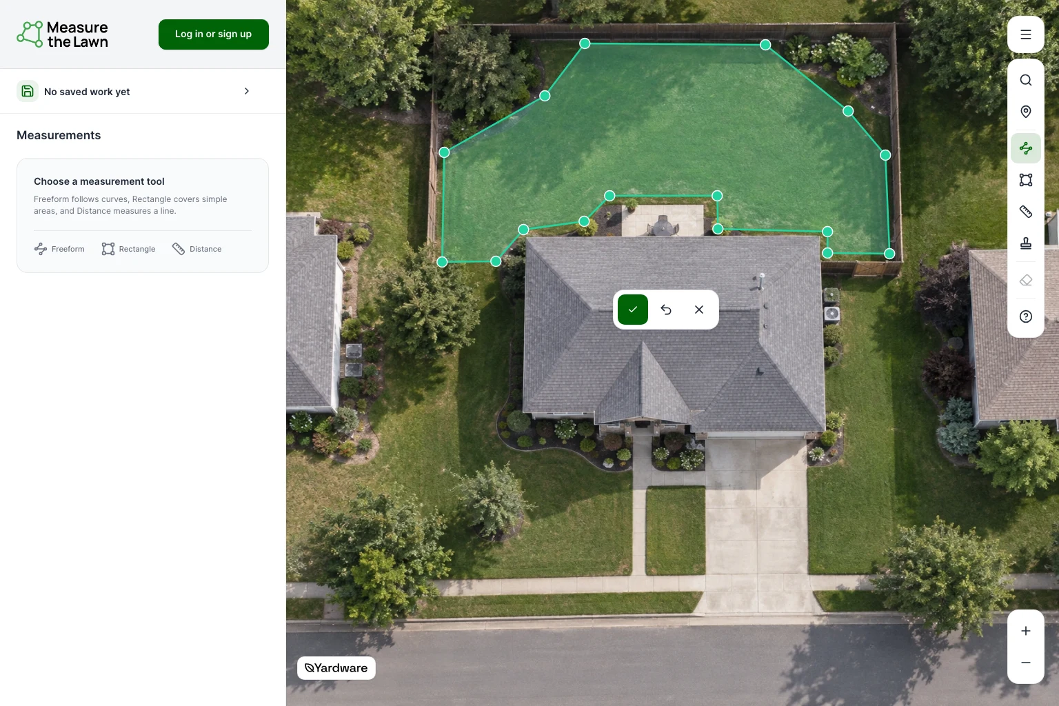 Fictional-home demonstration: Freeform points follow the back lawn around a patio, with the Finish drawing checkmark below.